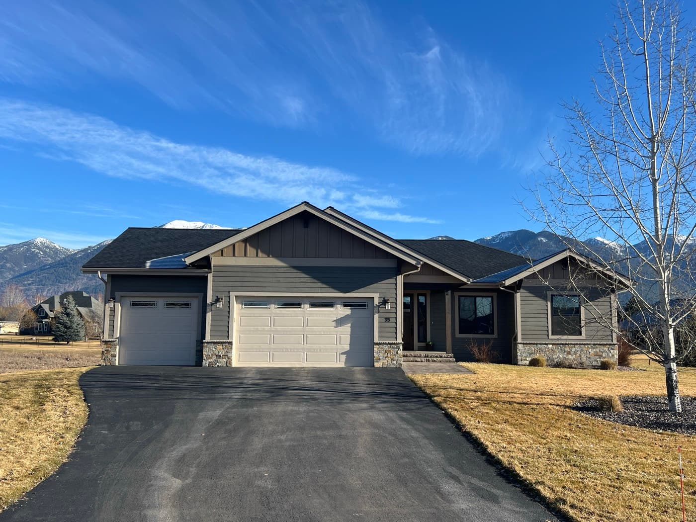 Craftsman ranch home with mountain backdrop