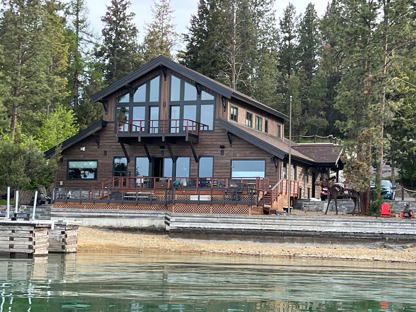Lakefront timber home with deck viewed from the water